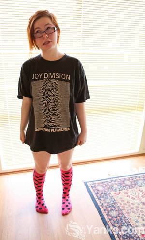 18 year old female Doris G slips off her underwear to pose naked on her bed